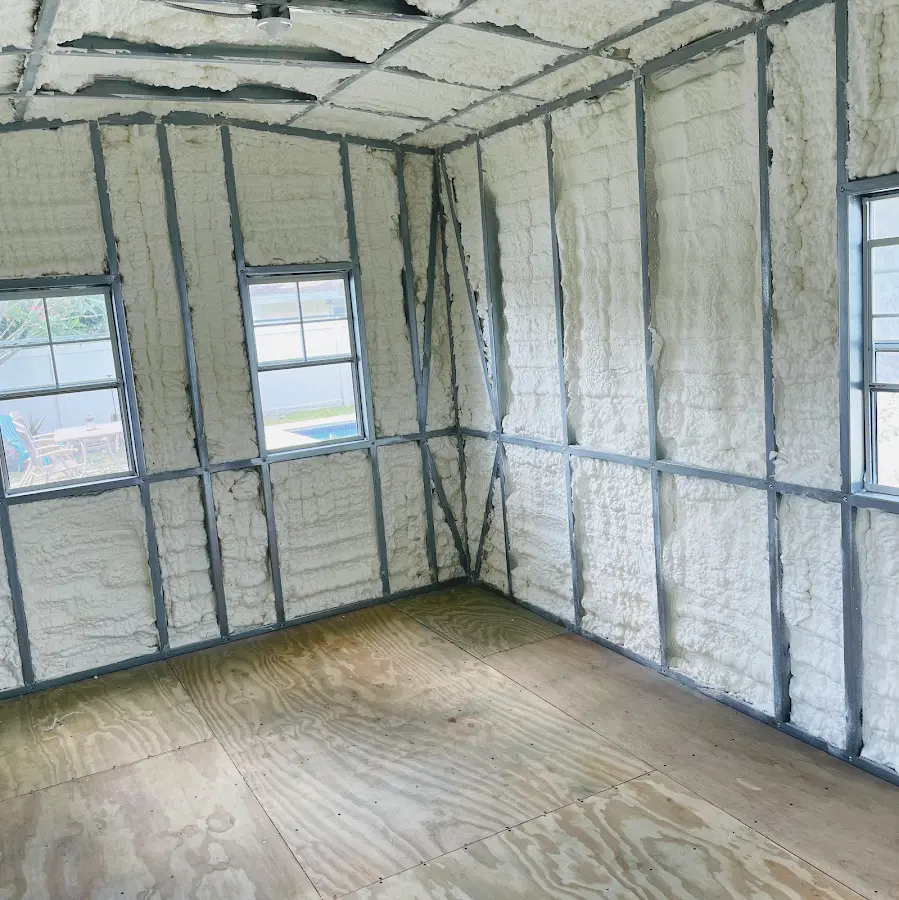 Closed-cell spray foam insulation applied to wall cavities in a residential project in Westminster